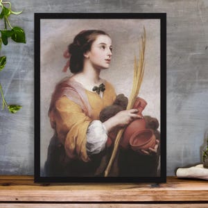 May include: Framed art print featuring a classical painting of a woman in a yellow and pink dress. She holds a red jug, a brown bundle, and a long, yellow stalk. The artwork is set against a neutral background.