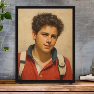 May include: Framed portrait of a young person with curly brown hair, wearing a red polo shirt with a blue collar and white backpack straps. The artwork is displayed on a wooden surface.