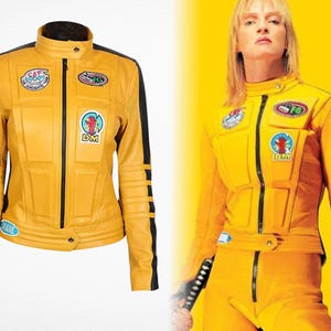 May include: A yellow leather jacket with black stripes and patches. The jacket has a stand-up collar, a front zipper, and multiple patches with text and graphics. The sleeves have black stripes. The jacket is inspired by a movie.