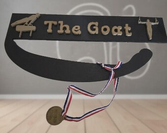 El poseedor de la medalla de cabra para gimnastas masculinos y femeninos