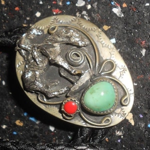 Dry-Creek Turquoise Bolo With Coral & Sterling &quot;End Of Trail&quot; Motif Large Oval W/Scalloping and a 3-D Metal Relief