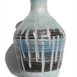 May include: A blue and brown ceramic vase with a textured glaze. The vase has a narrow neck and a wide, rounded body.