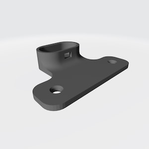 Może przedstawiać: Ciemnoszary, renderowany w 3D wspornik z owalnym wierzchem i płaską podstawą w kształcie litery T. Podstawa posiada dwa okrągłe otwory. Wierzch ma prostokątne wycięcie. Obiekt umieszczony jest na gładkim, jasnym tle.