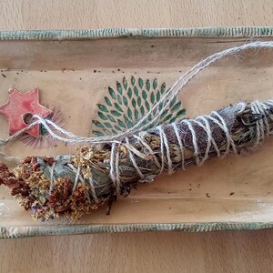 Ceramic bowl with incense bundle