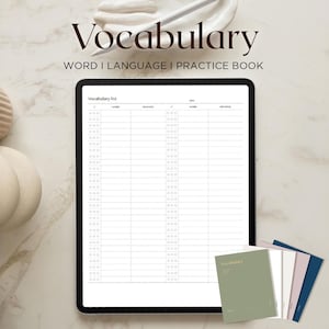 May include: A digital tablet displaying a vocabulary list, with the title "Vocabulary" above. The image includes a stack of small notebooks in various colors and decorative objects. The background is a light marble pattern.