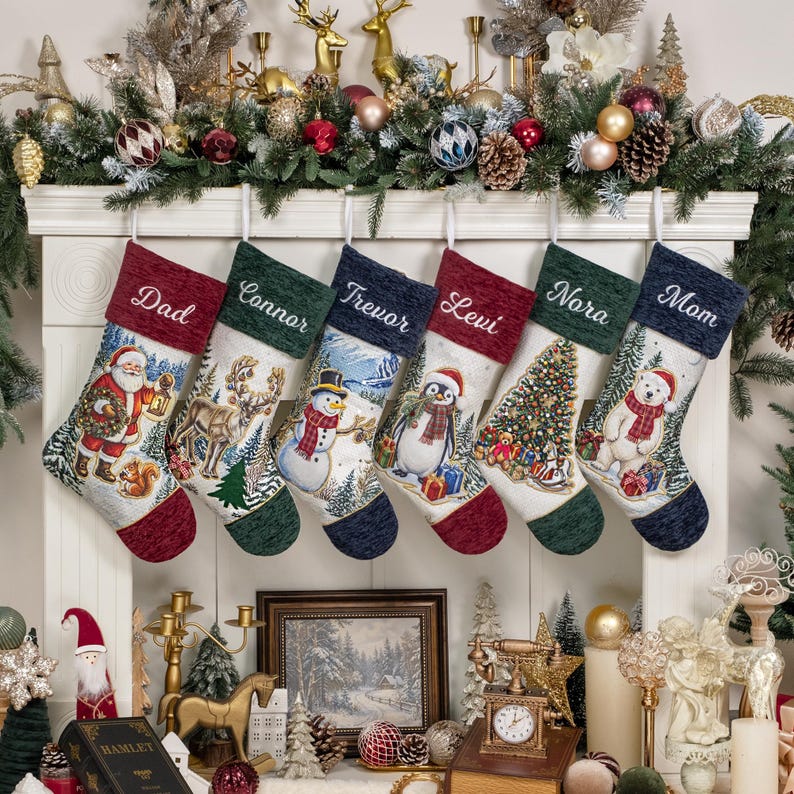 May include: Six Christmas stockings hanging in a row, each featuring a unique holiday scene including Santa, a reindeer, a snowman, a penguin, a Christmas tree, and a polar bear. Each stocking has a personalised name embroidered on the cuff.