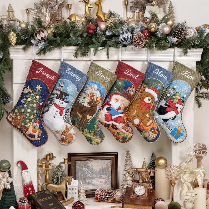 May include: Six personalized Christmas stockings hanging from a mantel, each featuring unique embroidered names: Joseph, Emery, Stacy, Dad, Mom, and Kim. The stockings display festive scenes including a snowman, reindeer, Santa, and a teddy bear.