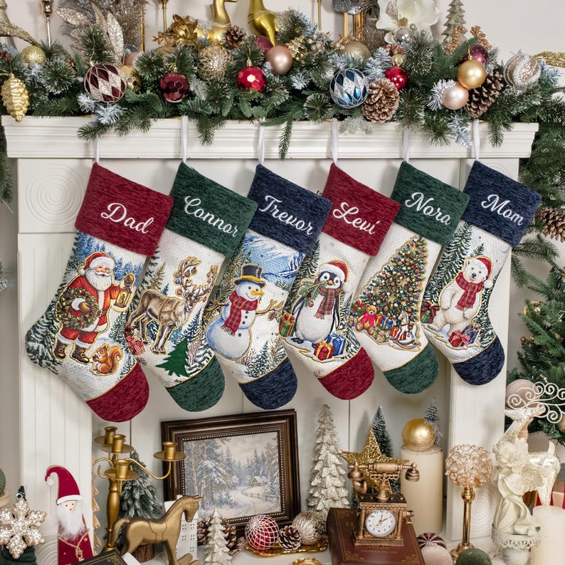May include: Six Christmas stockings hanging in a row, each featuring a unique holiday scene including Santa, a reindeer, a snowman, a penguin, a decorated tree, and a polar bear. Each stocking is personalised with names: Dad, Connor, Trevor, Levi, Nora, and Mom.