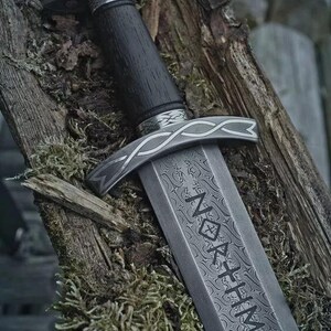 Handmade Viking sword with a Carbon steel blade and full tang design, featuring a detailed wave pattern. Comes with a custom hand-carved leather sheath, perfect for collectors or as a unique gift for men.