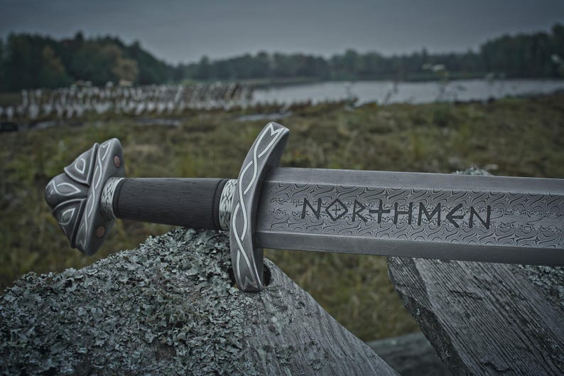 Handmade Viking sword with a Carbon steel blade and full tang design, featuring a detailed wave pattern. Comes with a custom hand-carved leather sheath, perfect for collectors or as a unique gift for men.