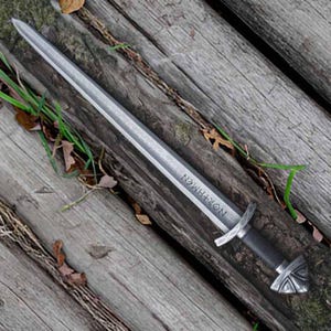 Handmade Viking sword with a Carbon steel blade and full tang design, featuring a detailed wave pattern. Comes with a custom hand-carved leather sheath, perfect for collectors or as a unique gift for men.