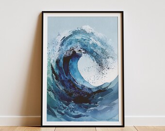 May include: Framed art print featuring a watercolor depiction of a crashing ocean wave. The artwork showcases shades of blue and white, with a dark blue center. The black frame is set against a white wall and a wooden floor.
