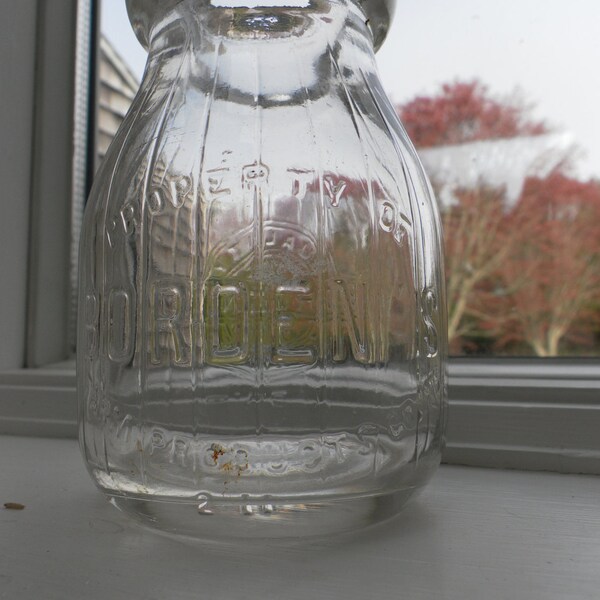 Bordens half pint milk bottle good condition ribbed  nice and clean Dug in NJ in 1970