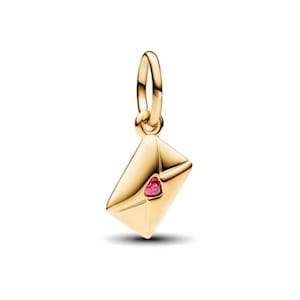 May include: A gold-colored charm in the shape of an envelope with a red heart-shaped gem. The charm has a loop at the top for attaching to a bracelet or necklace. The envelope is detailed with creases and folds.