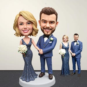 May include: A custom bobblehead figurine featuring a couple in formal wedding attire. The figure on the left wears a sparkling navy blue floor-length gown and holds a white bouquet. The figure on the right wears a navy blue suit with a bowtie.