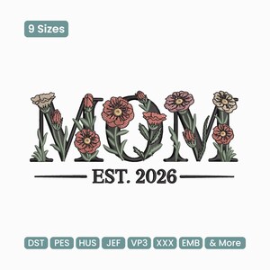 May include: An embroidered design featuring the word "MOM" with floral accents. The letters are black, and the flowers are pink and beige. Below the word is the text "EST. 2026". The design is suitable for embroidery projects.
