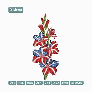 Op de afbeelding: Geborduurd bloemmotief met rode, witte en blauwe bloemen, die lijken op de Amerikaanse vlag. Het ontwerp bevat de tekst "9 Maten" en bestandstype-afkortingen. De bloemen hebben een gedetailleerd, gestructureerd uiterlijk.