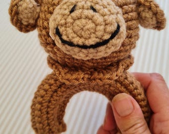 Cheeky monkey crochet rattle from Jungle collection.  Ideal baby shower or new born gift. Soft playable special keepsake