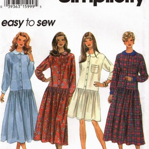May include: A sewing pattern for three different dresses. The pattern is for sizes 18, 20, and 22. The dresses are all long-sleeved and have a button-up front. The first dress is light blue, the second is red with white flowers, and the third is white with a plaid pattern.
