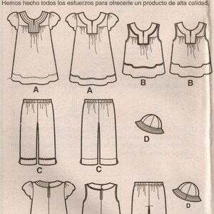 May include: A sewing pattern for a girl's dress, top, and pants. The pattern includes a hat. The pattern number is 2269.