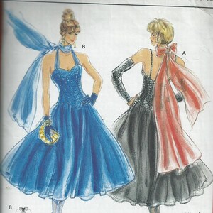 May include: A sewing pattern for two evening gowns. The pattern is for sizes 34 to 42, corresponding to sizes 8 to 16. The first gown is a blue tulle gown with a halter neckline and a full skirt. The second gown is a black tulle gown with a spaghetti strap neckline and a full skirt. Both gowns have a matching scarf.