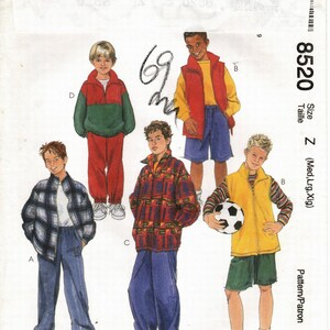 May include: A sewing pattern for boys' clothing, sizes medium, large, and extra large. The pattern includes a red vest, a green and red sweater, a plaid shirt, a blue and red jacket, and a yellow vest. The pattern is for a size 69.