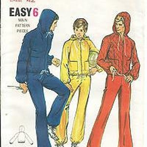 May include: A vintage sewing pattern for a hooded jacket and pants set. The pattern is for sizes 38, 40, 42, and 44. The pattern is called "Butterick 6473" and is labeled "Easy 6".