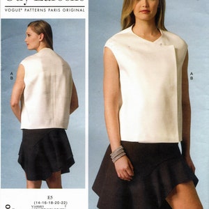 May include: A white sleeveless top with a V-neck and a black skirt with a ruffled hem. The skirt has a diagonal seam on the front. The pattern is for sizes 14-16-18-20-22. Vogue Patterns Paris Original. V1450/ES.