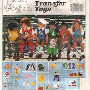 May include: A vintage sewing pattern for toddler's clothing with a colorful illustration of five children wearing the designs. The pattern includes a variety of iron-on transfers with images of animals, numbers, and other designs. The pattern number is 1844.