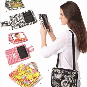 May include: Simplicity sewing pattern 1630 os for making tablet cases. The pattern includes instructions for making four different styles of cases, including a black and white paisley case, a yellow floral case, a pink case with a geometric pattern, and a black and white damask case.