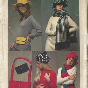 May include: Simplicity sewing pattern number 468, one size, for a hat, scarf, and bag. The pattern shows four different styles, including a yellow hat, a black and white houndstooth scarf, a red and green striped scarf, and a black and white animal print bag.