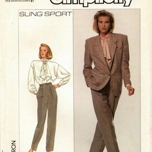 May include: Simplicity sewing pattern number 8340 for a blazer and pants. The pattern is for size 10, EUR 38. The pattern shows a woman wearing a plaid blazer and matching pants. The woman is wearing a white blouse with a bow tie.