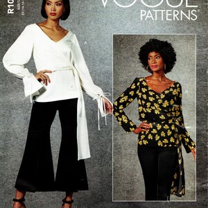 May include: Two women's tops with a wrap style. The top on the left is white with long sleeves and a tie at the waist. The top on the right is black with a floral print and long sleeves. Both tops have a V-neckline. Vogue Patterns R10456.