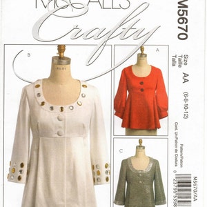 May include: A sewing pattern for a dress with three different styles. The pattern is for sizes 6-8-10-12 and is called McCall's Crafty M5670/AA.