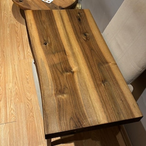 Custom size floating vanity shelf installed in spa-inspired bathroom.