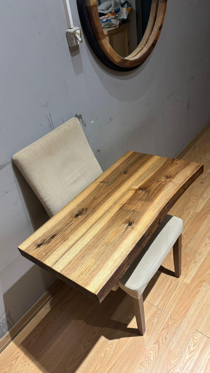 Solid wood sink countertop highlighting authentic live edge contour.