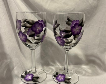 Wine glasses with hand painted purple flowers and black/silver leaves.