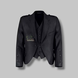 May include: A dark grey formal jacket and waistcoat set. The jacket features a notched lapel, button fastenings, and decorative sleeve buttons. The waistcoat has a button-down front. The text "PIPERS & MASONS" is visible on the jacket.