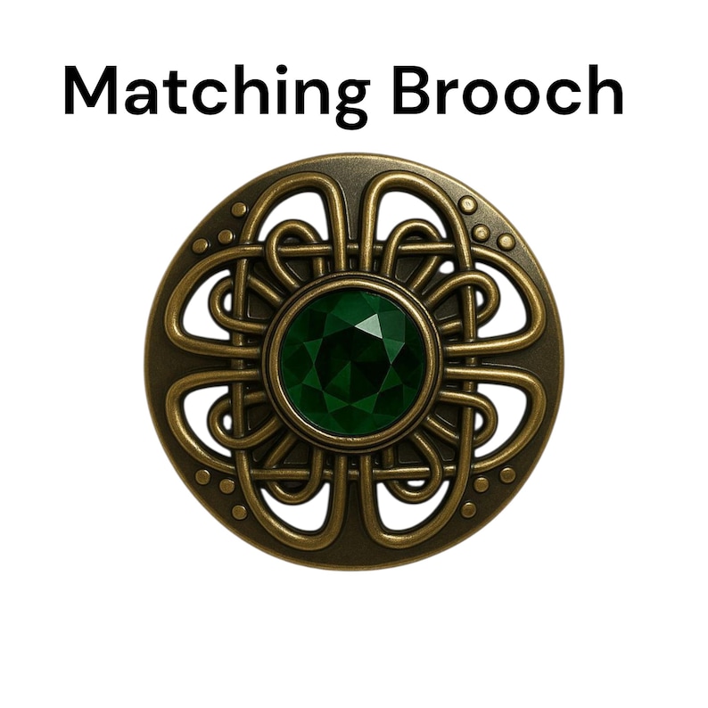 May include: A round, antique-style brooch with a central emerald-green gemstone. The brooch features an intricate, Celtic-inspired knotwork design in a bronze-colored metal. The text "Matching Brooch" is displayed above the brooch.