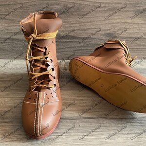 Close-up of leather stitching on Roman historical boots showing craftsmanship and durability