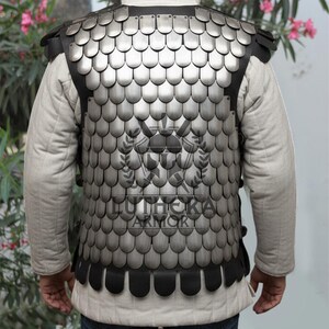 Adjustable straps on medieval scale armor back view