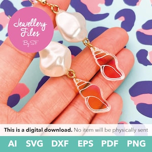 May include: Dangle earrings featuring a white irregular pearl-like bead attached to a gold-tone metal hook and a translucent orange seashell-shaped charm with a white outline. The design includes the text Jewellery Files By SF.