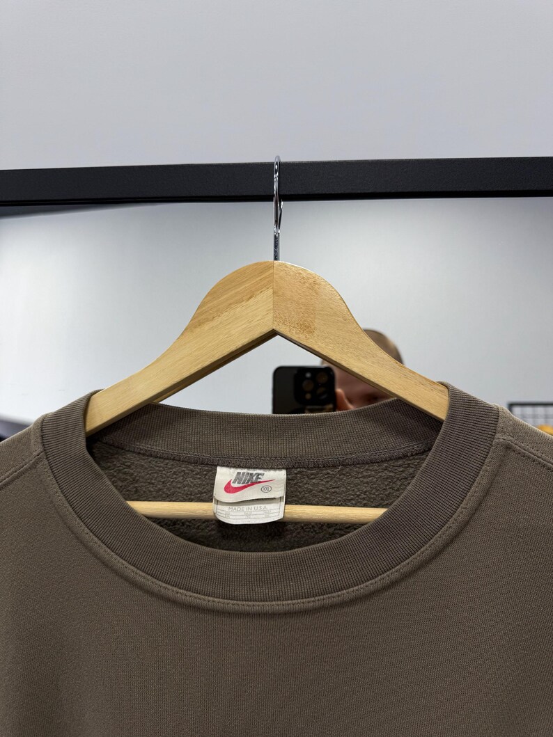 May include: A set of three ceramic mugs with a speckled, matte finish. The mugs are in shades of cream, light gray, and dark gray. Each mug has a simple, minimalist design, perfect for coffee or tea.