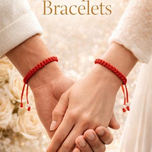 May include: Red braided couple bracelets with adjustable ties, held hands. The bracelets are a vibrant red, with white and red beads at the ends of the ties. The image has the text "Couple Bracelets".