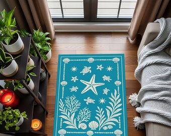 May include: A rectangular turquoise rug with a white border and a marine life design. The rug features a starfish, sea turtles, seashells, and coral. The rug is placed on a wooden floor, near a window and a couch.