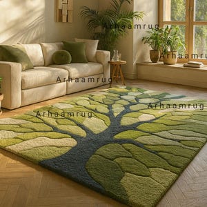 May include: A green and gray area rug with a tree design. The rug features a dark gray trunk and various shades of green leaves. The rug is placed on a wooden floor in a living room setting, with a beige sofa and green pillows.