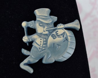 Vintage Brooch Featuring a Marching Band Dog Playing the Horn and Drums Plastic Pin