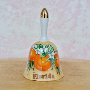 Vintage Florida Ceramic Souvenir Bell with Transferred Orange Images and Gold Painted Top