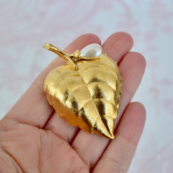 Avon perfume deals brooch