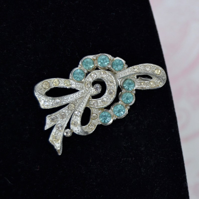 Vintage Bow Brooch with Clear and Blue Rhinestones Mades of Pot Metal image 1